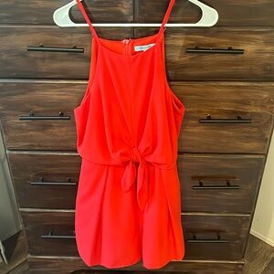 Red romper with knot detail